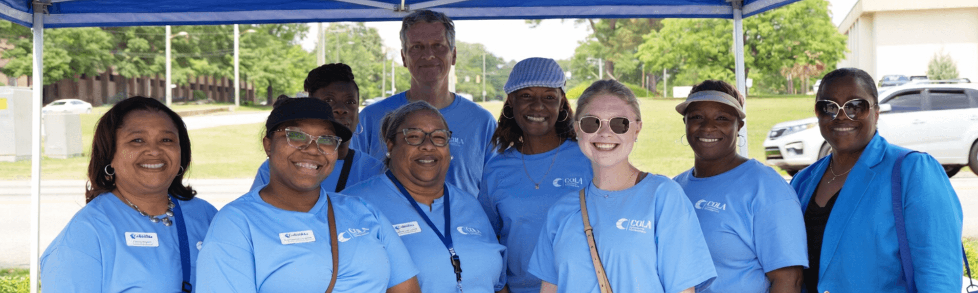 Picture of the Community Development Team. 10 people wearing blue team shirts.